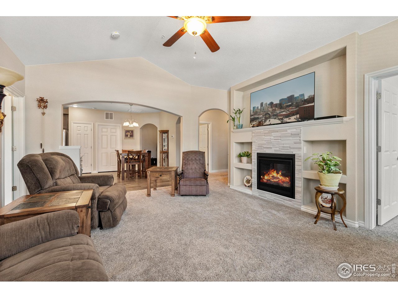4672 West 20th Road, Unit 723 Greeley, CO 80634 - Photo 14 of 27 a living room with furniture and a fireplace