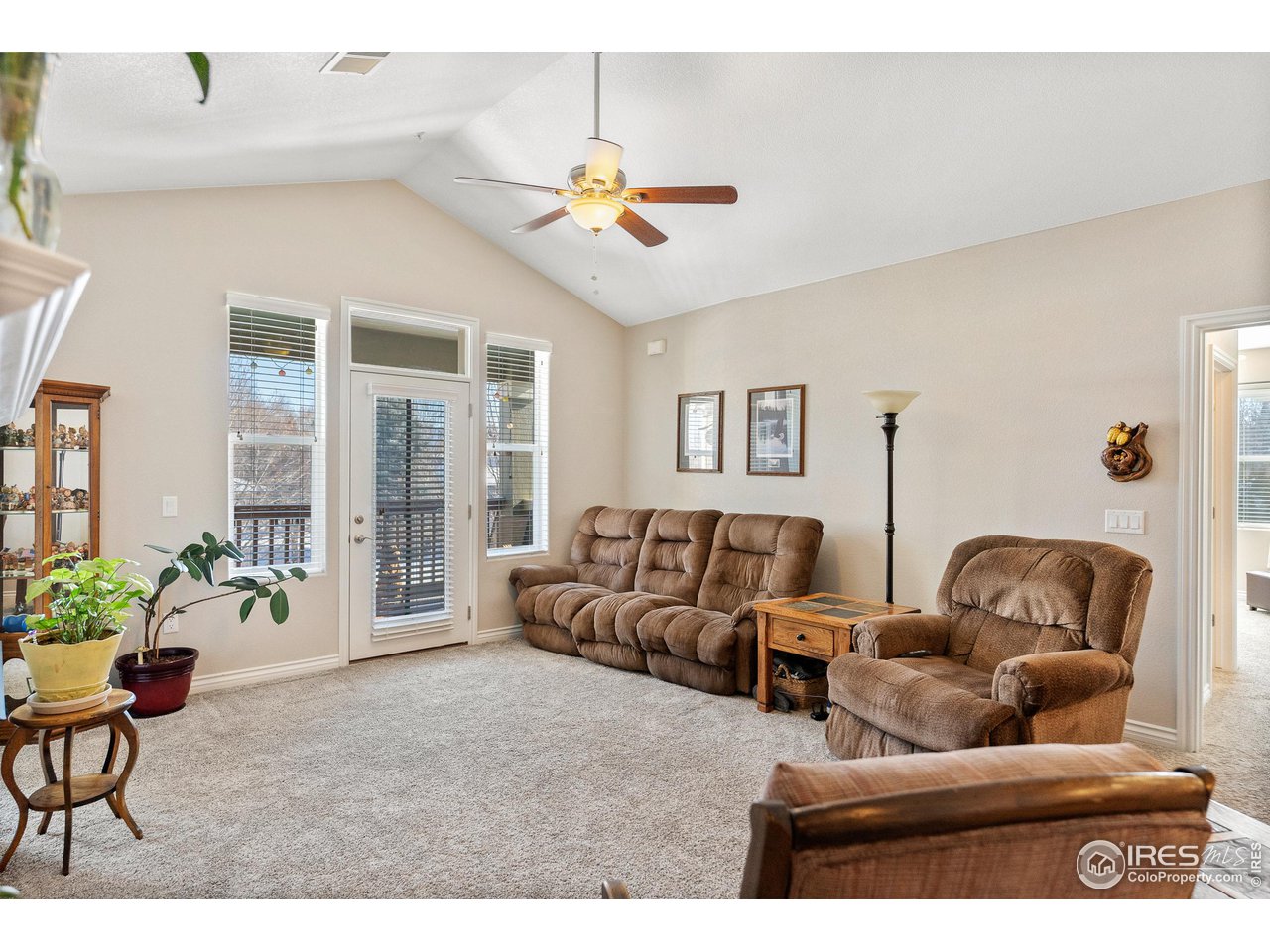 4672 West 20th Road, Unit 723 Greeley, CO 80634 - Photo 16 of 27 a living room with furniture and a large window