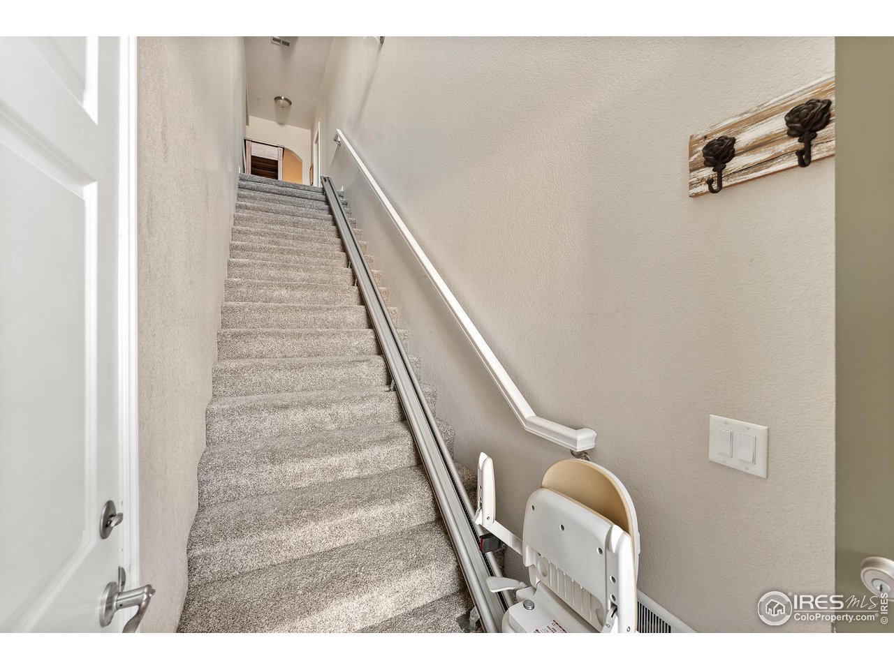 4672 West 20th Road, Unit 723 Greeley, CO 80634 - Photo 18 of 27 a view of a hallway with staircase