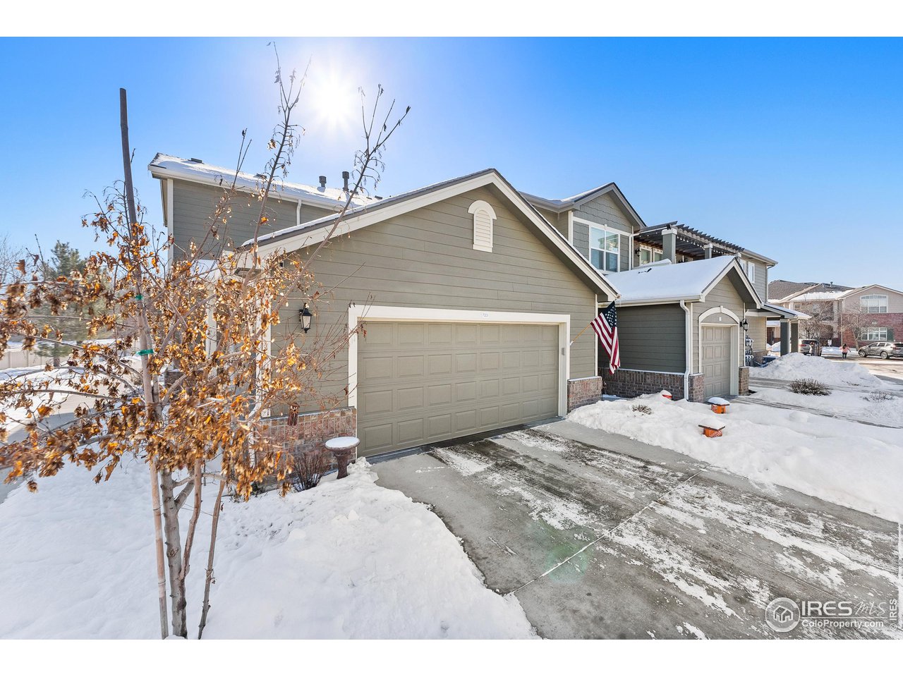 4672 West 20th Road, Unit 723 Greeley, CO 80634 - Photo 2 of 27 a bedroom with a bed and a chandelier
