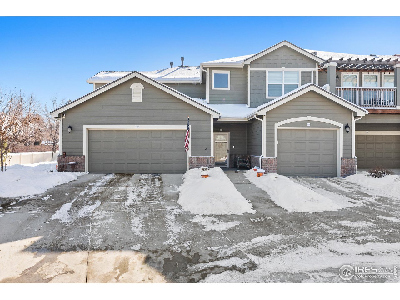 4672 West 20th Road, Unit 723 Greeley, CO 80634 - Photo 3 of 27 a view of a white house with a outdoor space