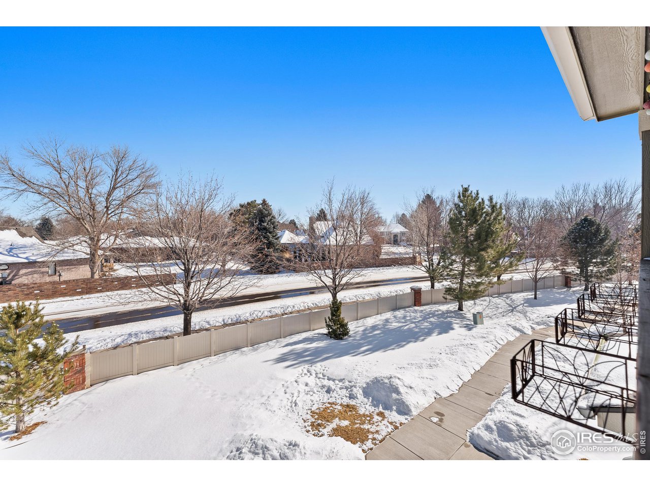4672 West 20th Road, Unit 723 Greeley, CO 80634 - Photo 6 of 27 a view of a terrace with a bench and trees around