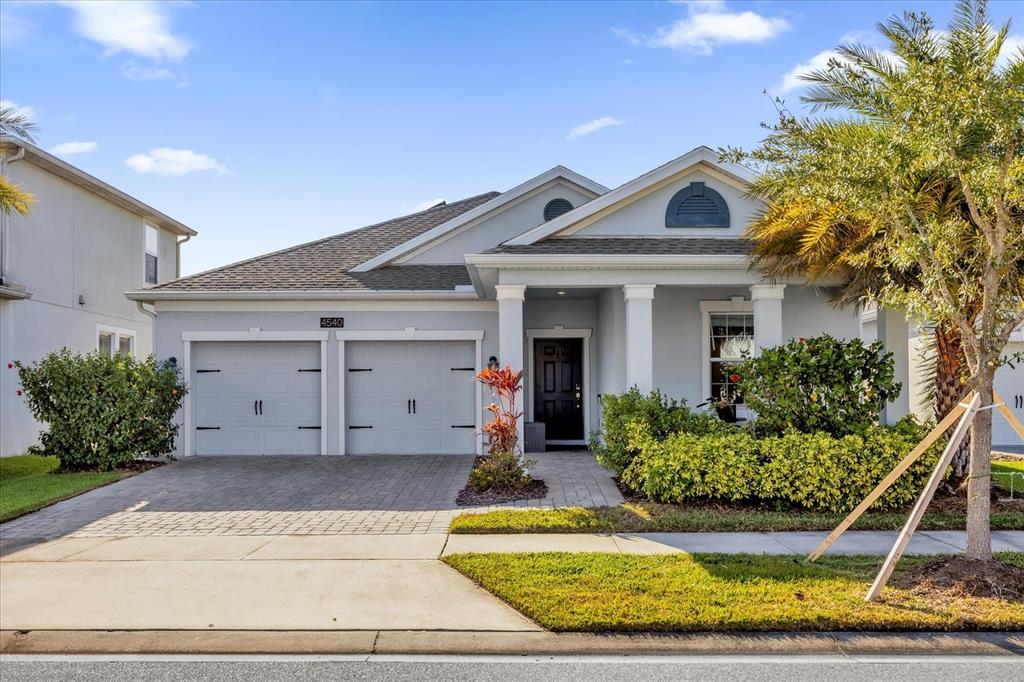 4540 Sequel Road Kissimmee, FL 34746 - Photo 1 of 1 a front view of a house with a yard and garage