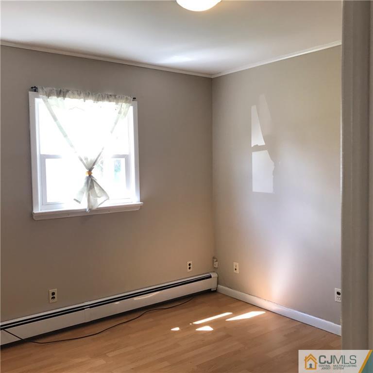 46 Rosewood Road Edison, NJ 08817 - Photo 14 of 25 an empty room with a window
