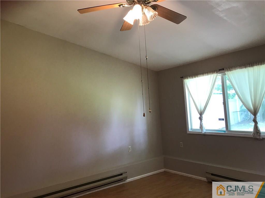 46 Rosewood Road Edison, NJ 08817 - Photo 8 of 25 an empty room with a window