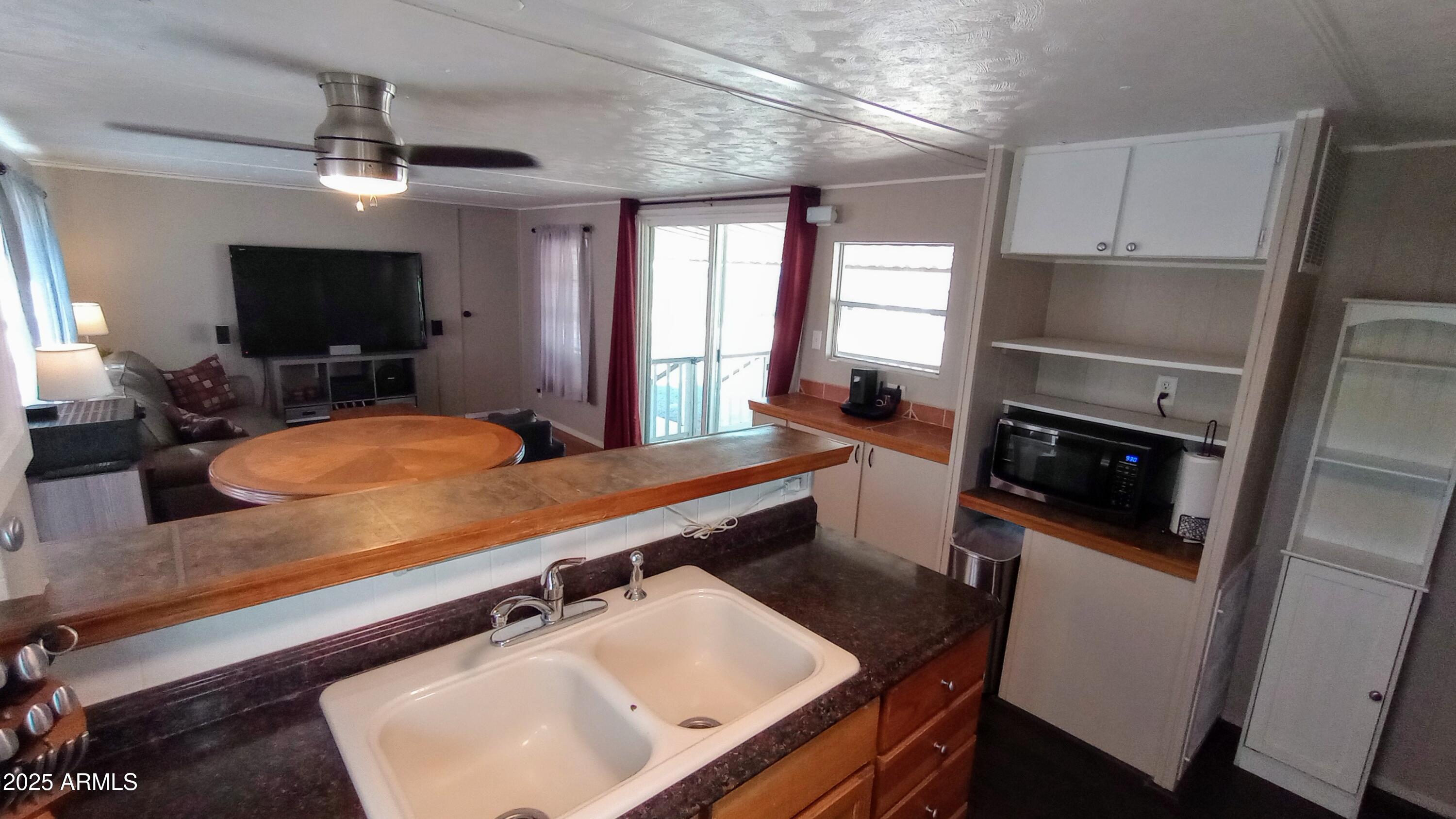 269 North Winchester Road, Unit 2 Apache Junction, AZ 85119 - Photo 11 of 36 a room with furniture pool table flat screen tv and windows