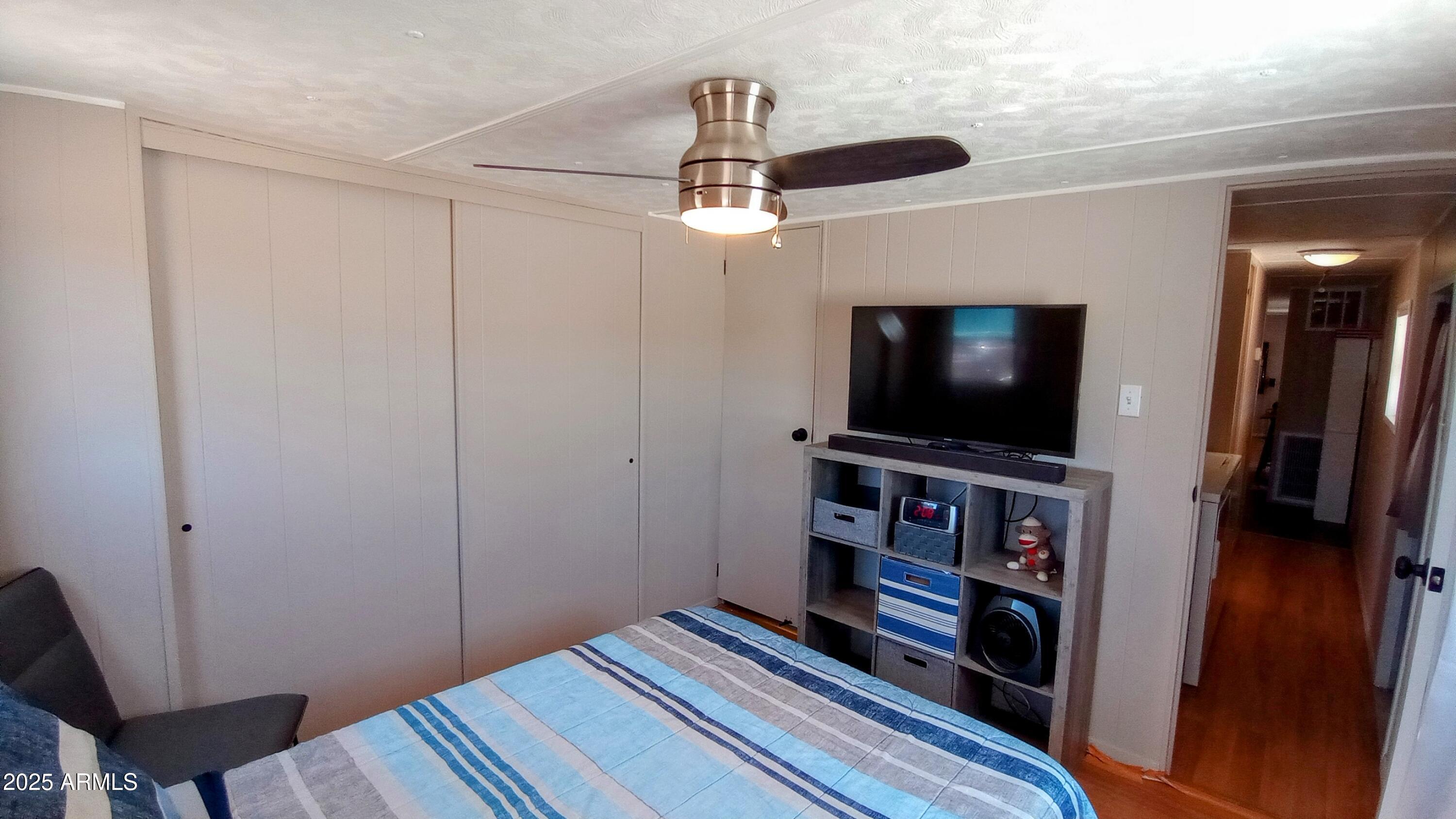 269 North Winchester Road, Unit 2 Apache Junction, AZ 85119 - Photo 13 of 36 a view of a livingroom with furniture and a flat screen tv