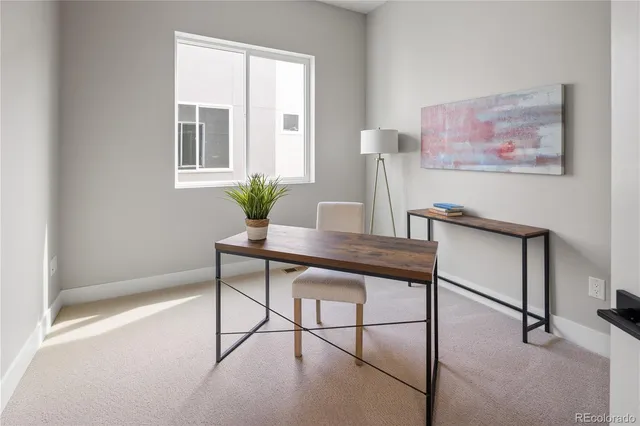 a view of a livingroom with furniture and window