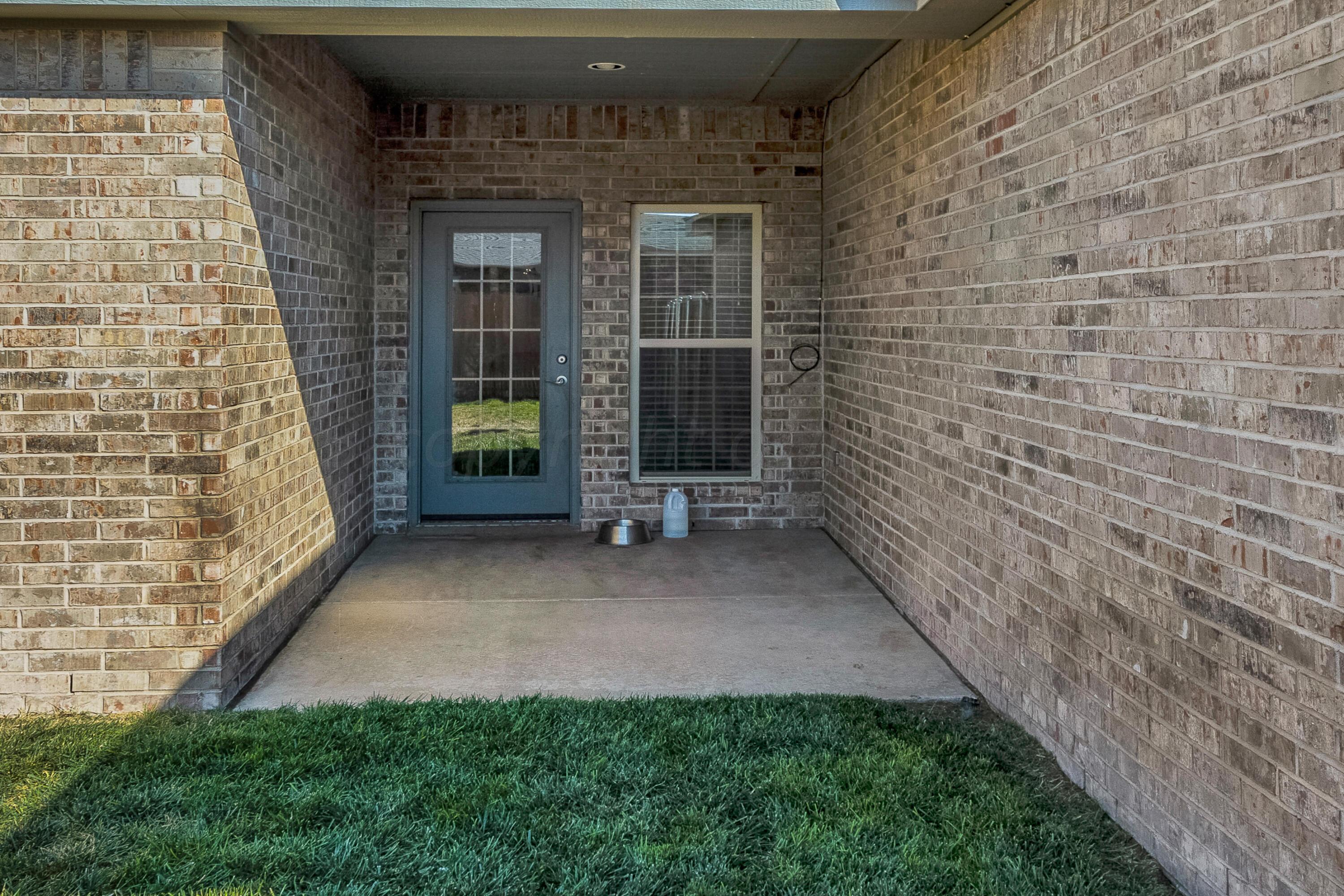 9927 Perry Avenue Amarillo, TX 79119 - Photo 22 of 24 a view of a back yard of the house