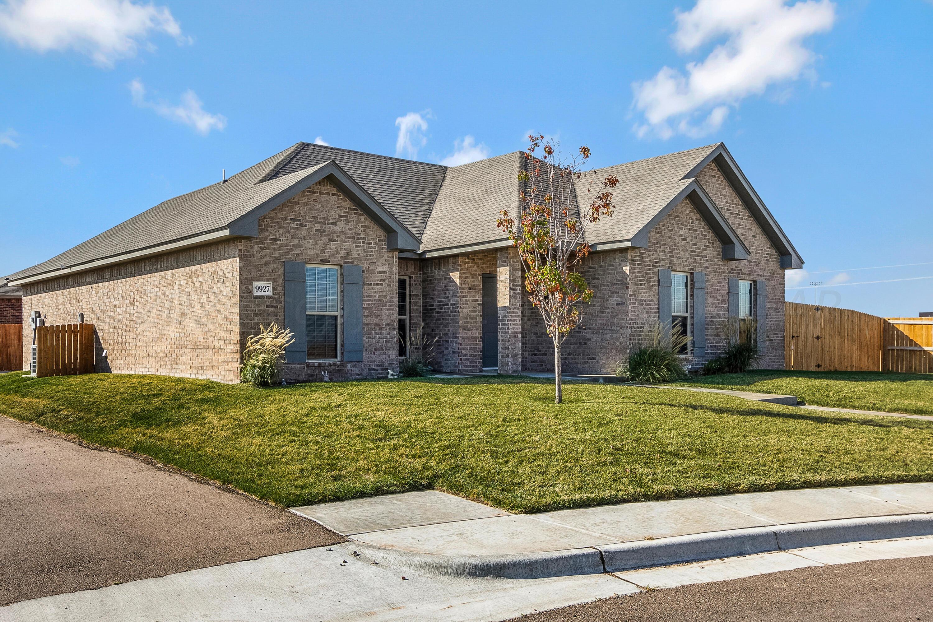 9927 Perry Avenue Amarillo, TX 79119 - Photo 24 of 24 a front view of a house with a garden