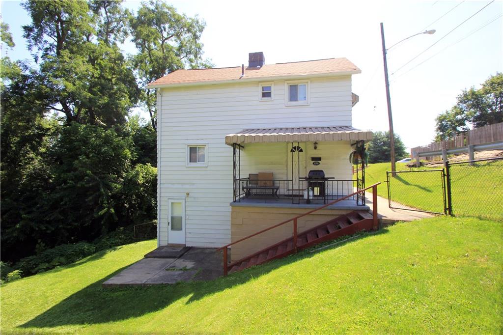 1360 Center Street McKees Rocks, PA 15136 - Photo 1 of 19 Wonderful two story 2 bedroom house with 2 additional lots included. Spacious covered porch and large partially fenced yard. The newer dimensional roof was installed in 2012 and there are newer multi-pane windows too!