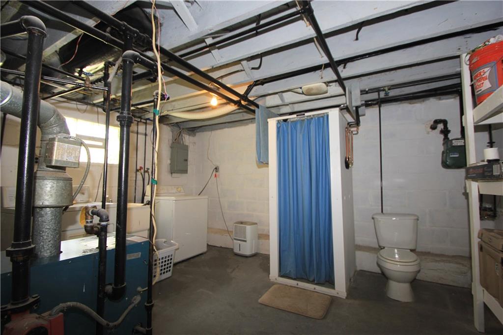 1360 Center Street McKees Rocks, PA 15136 - Photo 15 of 19 This alternate view of the front of the basement shows the shower stall and the toilet.