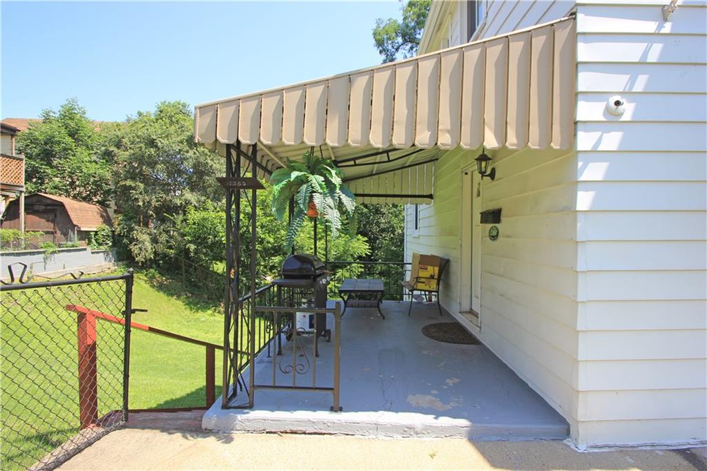 1360 Center Street McKees Rocks, PA 15136 - Photo 17 of 19 The covered side porch is a great place to relax outside and cook on the grill! Plenty of space for a table, chairs and the grill!