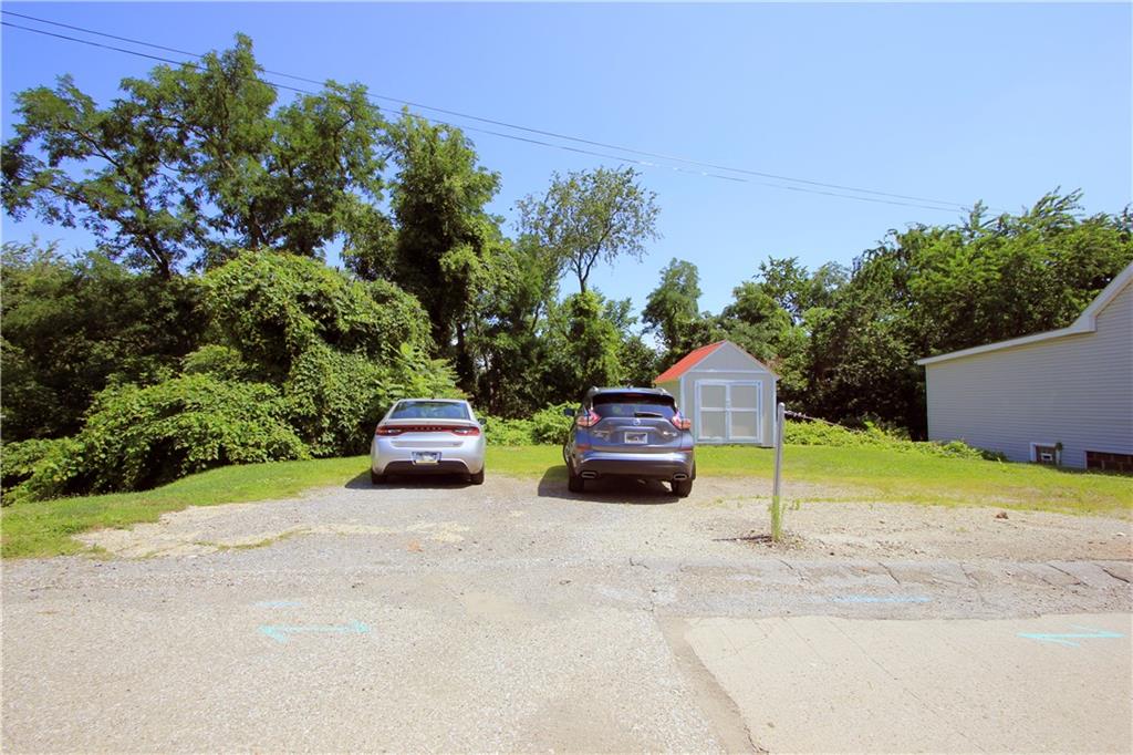 1360 Center Street McKees Rocks, PA 15136 - Photo 19 of 19 This parcel is also included in the sale and provides enough space for 3-4 or more cars. The steps to the house are just to the left of the parking spaces. The shed shown is included in the sale as well.