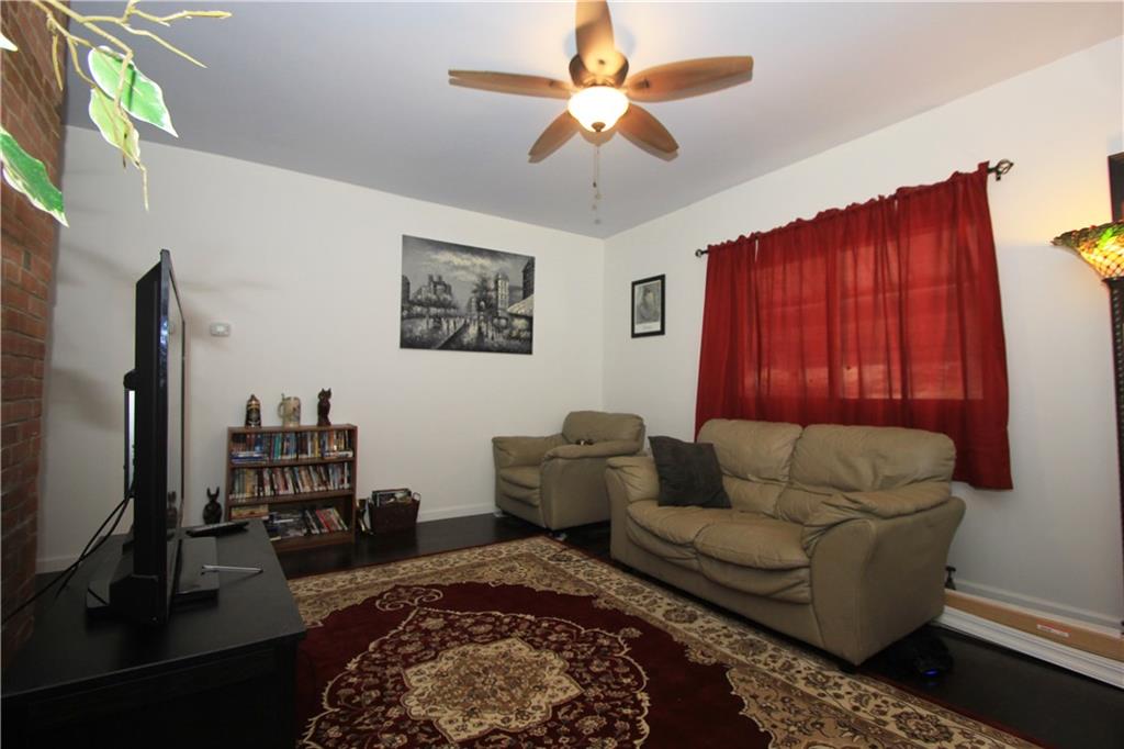 1360 Center Street McKees Rocks, PA 15136 - Photo 3 of 19 The living room was remodeled by the current owner who installed new drywall and bamboo flooring. The decorative fireplace was covered over when he bought the house!