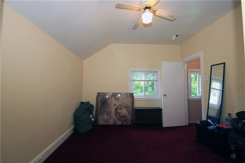 1360 Center Street McKees Rocks, PA 15136 - Photo 7 of 19 The master bedroom is a large room with nice plush carpet and neutral tone walls. There is a window that provides ample natural light into the room and a lighted paddle fan for the evening hours.