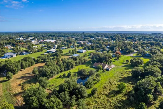 an aerial view of multiple house with outdoor space