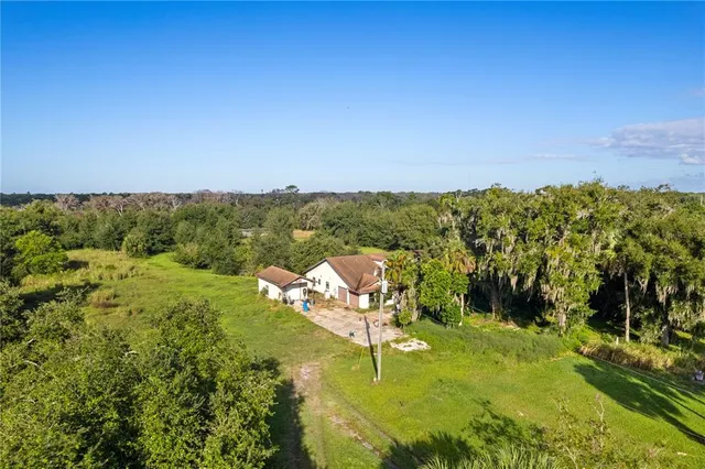 a view of a lake with houses in all around