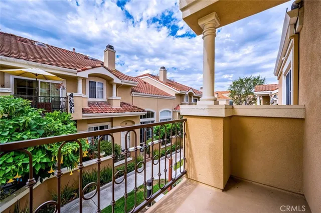 wooden floor in an empty room and a kitchen view