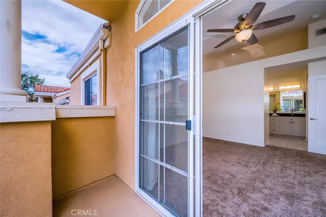 an empty room with a empty space and a ceiling fan