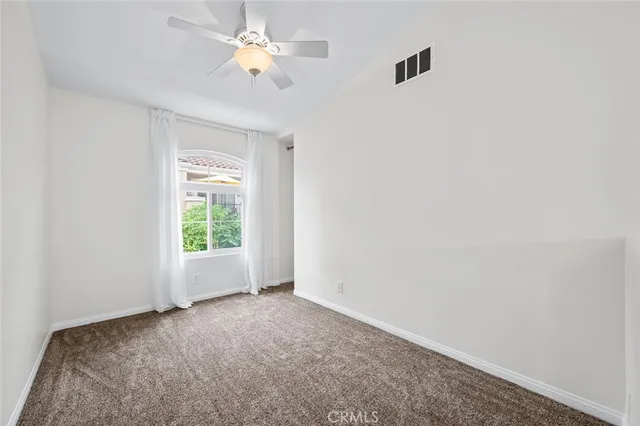 wooden floor in an empty room with a mirror