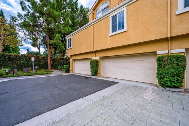 a view of a house with a tub and wooden fence