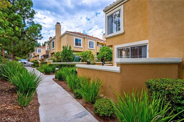 a view of a patio with couches and pool