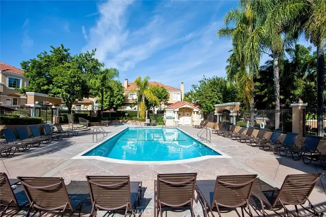 a view of a field with grass and a small yard