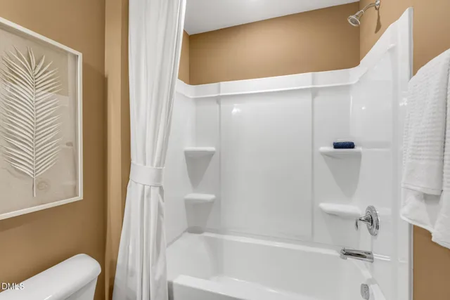 a view of kitchen with refrigerator dining table and chairs