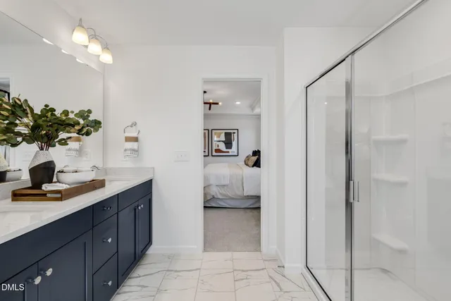a kitchen with a refrigerator a stove a sink and chairs