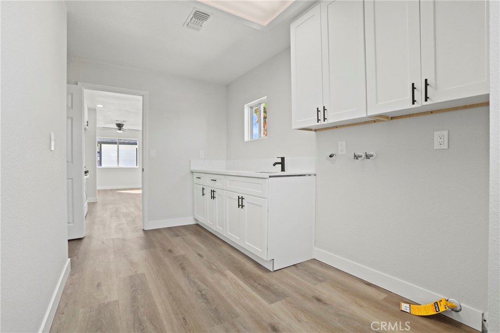 1116 7th Street Calimesa, CA 92320 - Photo 18 of 52 a view of kitchen with wooden floor