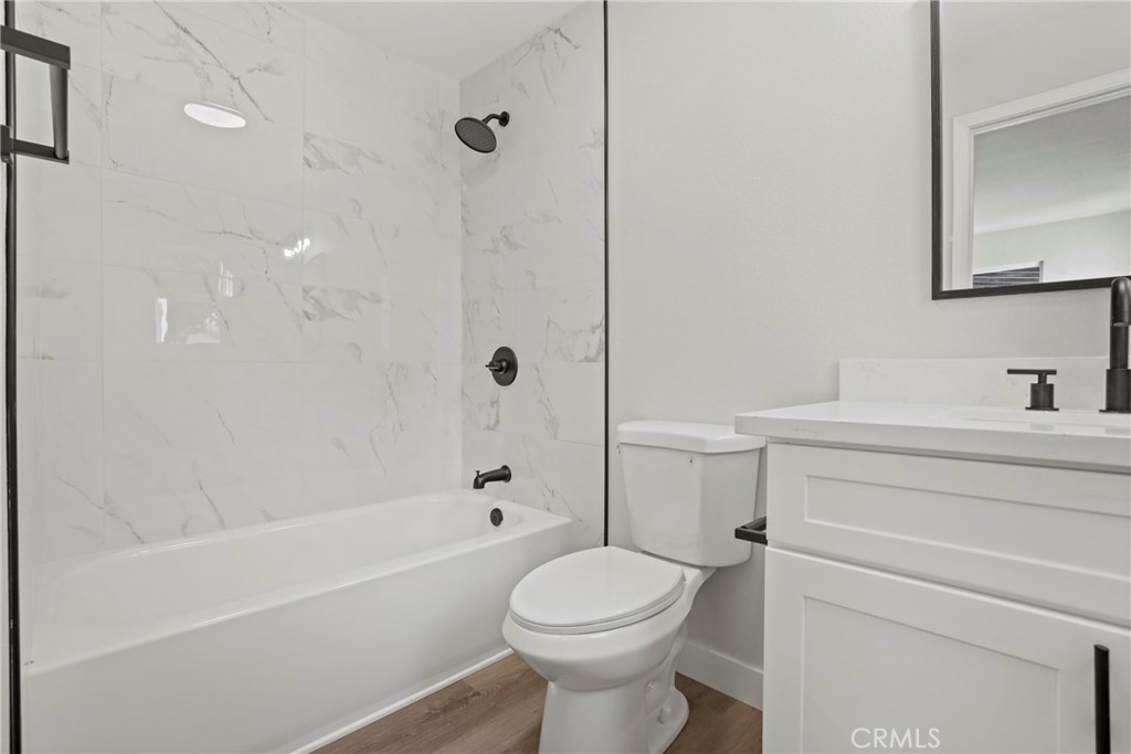 1116 7th Street Calimesa, CA 92320 - Photo 22 of 52 a bathroom with a sink toilet and shower