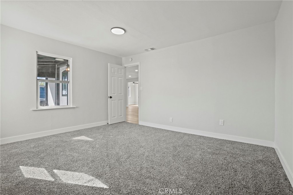 1116 7th Street Calimesa, CA 92320 - Photo 23 of 52 a view of an empty room with a window