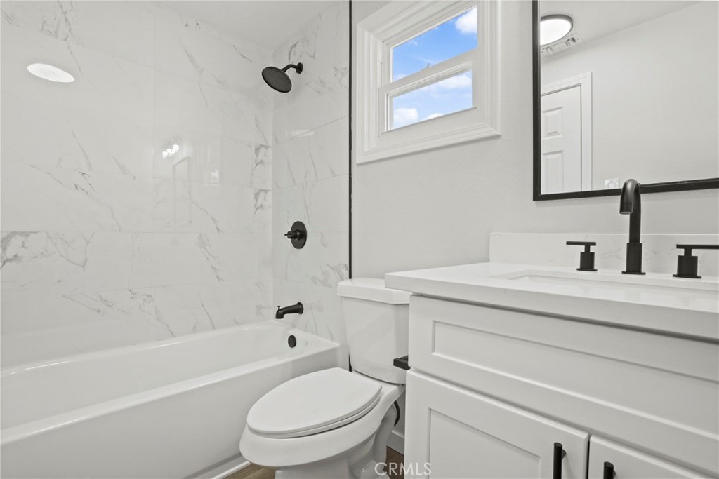 1116 7th Street Calimesa, CA 92320 - Photo 27 of 52 a bathroom with a sink a toilet and a bathtub