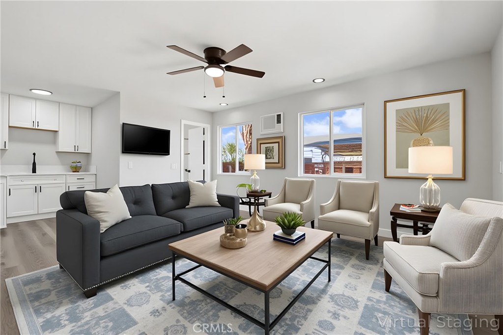 1116 7th Street Calimesa, CA 92320 - Photo 34 of 52 a living room with furniture kitchen view and a window
