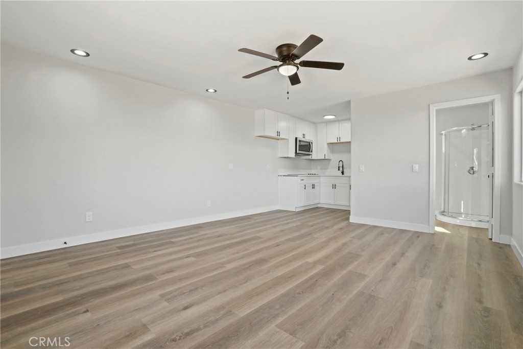 1116 7th Street Calimesa, CA 92320 - Photo 38 of 52 a view of a kitchen with a dishwasher and wooden floor