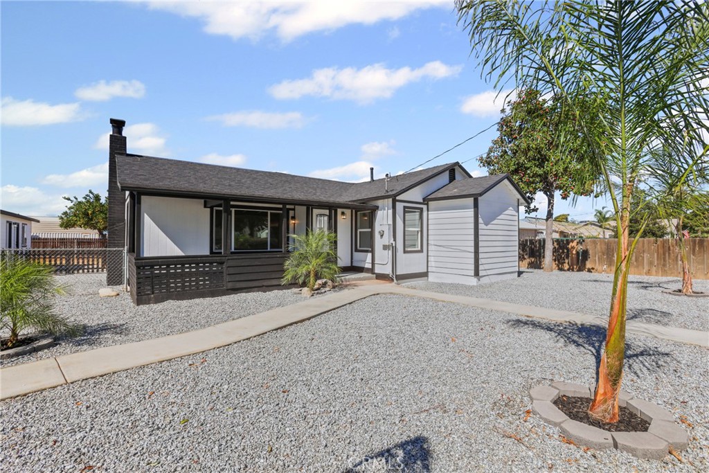 1116 7th Street Calimesa, CA 92320 - Photo 4 of 52 a front view of a house with garden