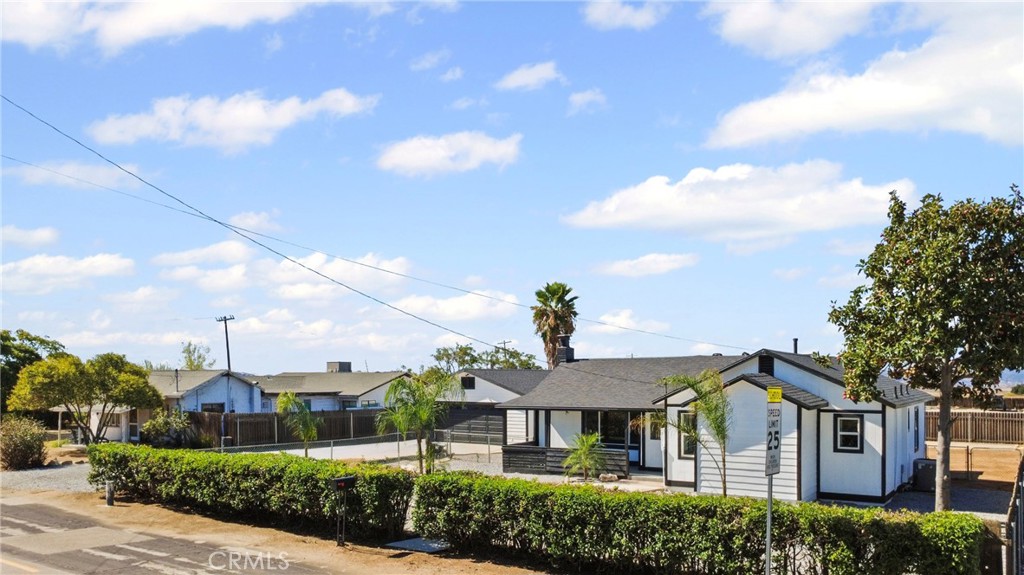 1116 7th Street Calimesa, CA 92320 - Photo 5 of 52 a front view of a house with a yard