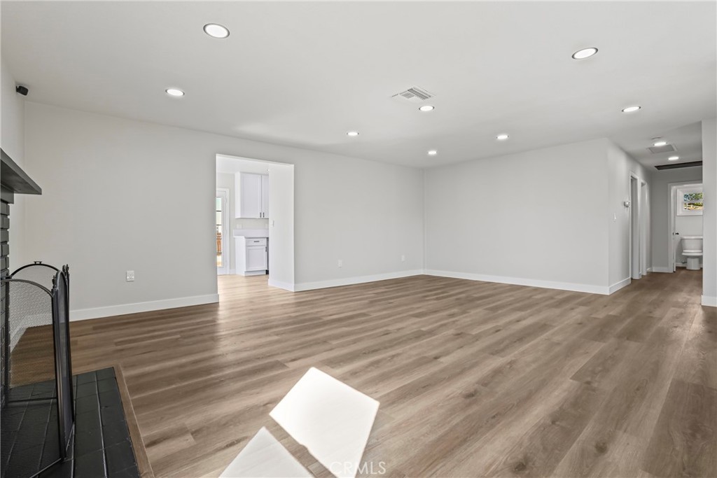 1116 7th Street Calimesa, CA 92320 - Photo 7 of 52 a view of empty room with wooden floor
