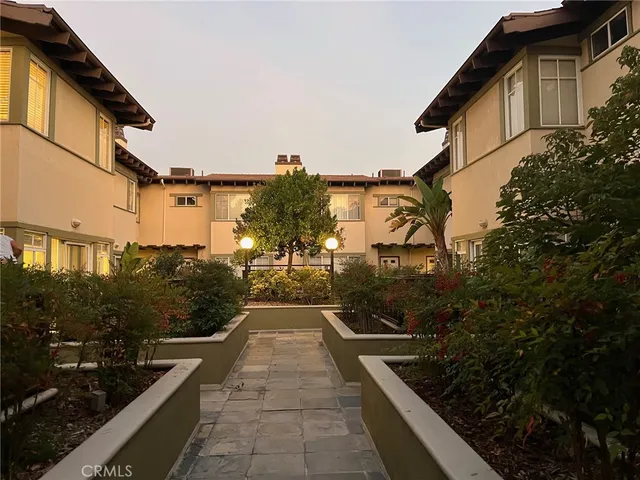 a view of a backyard with sitting area