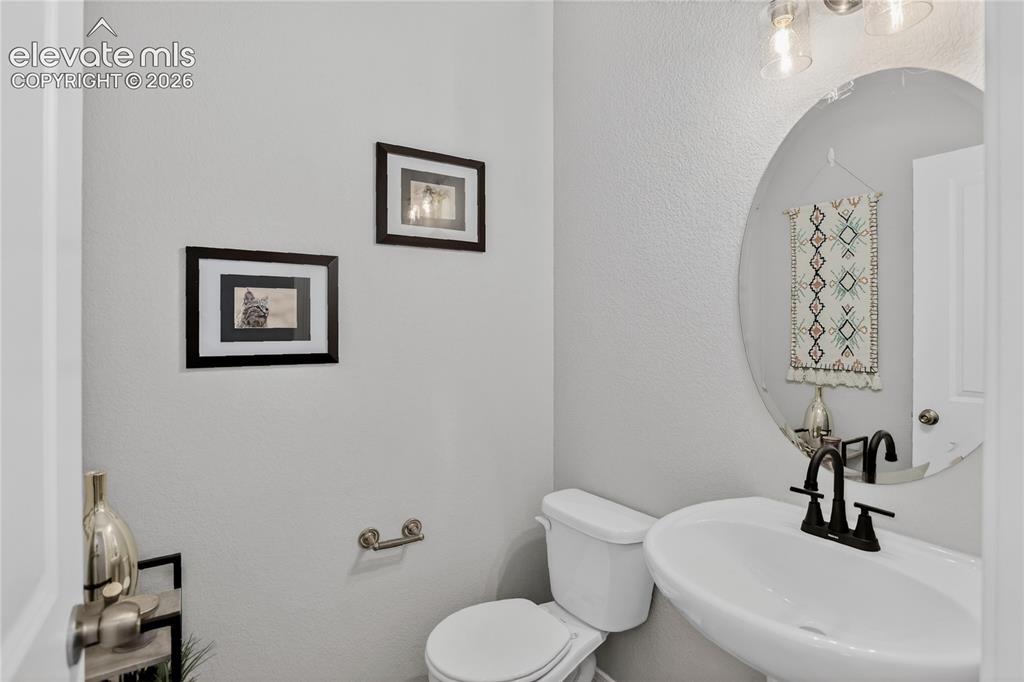 9734 Hidden Ranch Court Peyton, CO 80831 - Photo 13 of 29 Powder room - main level