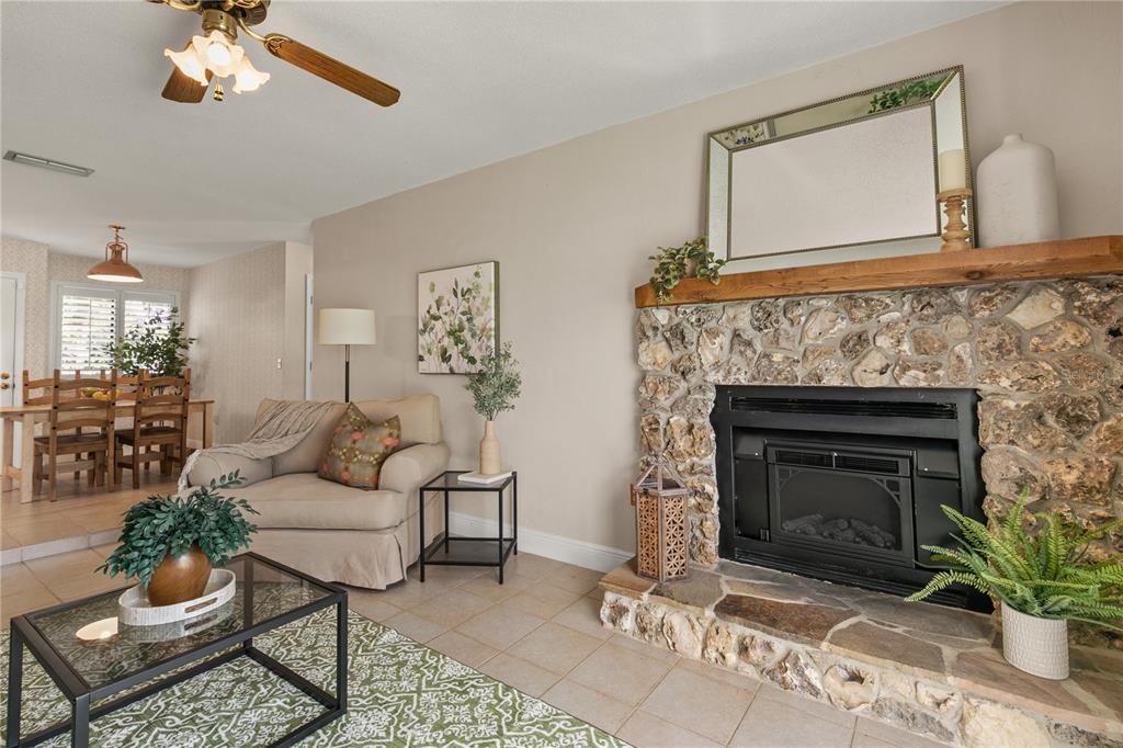 100 Bittern Court Daytona Beach, FL 32119 - Photo 17 of 52 a living room with furniture and a fireplace
