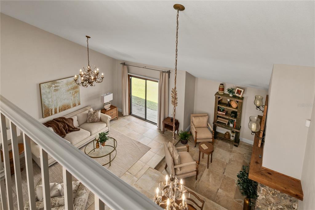 100 Bittern Court Daytona Beach, FL 32119 - Photo 25 of 52 a view of a dining room and livingroom with furniture wooden floor a chandelier