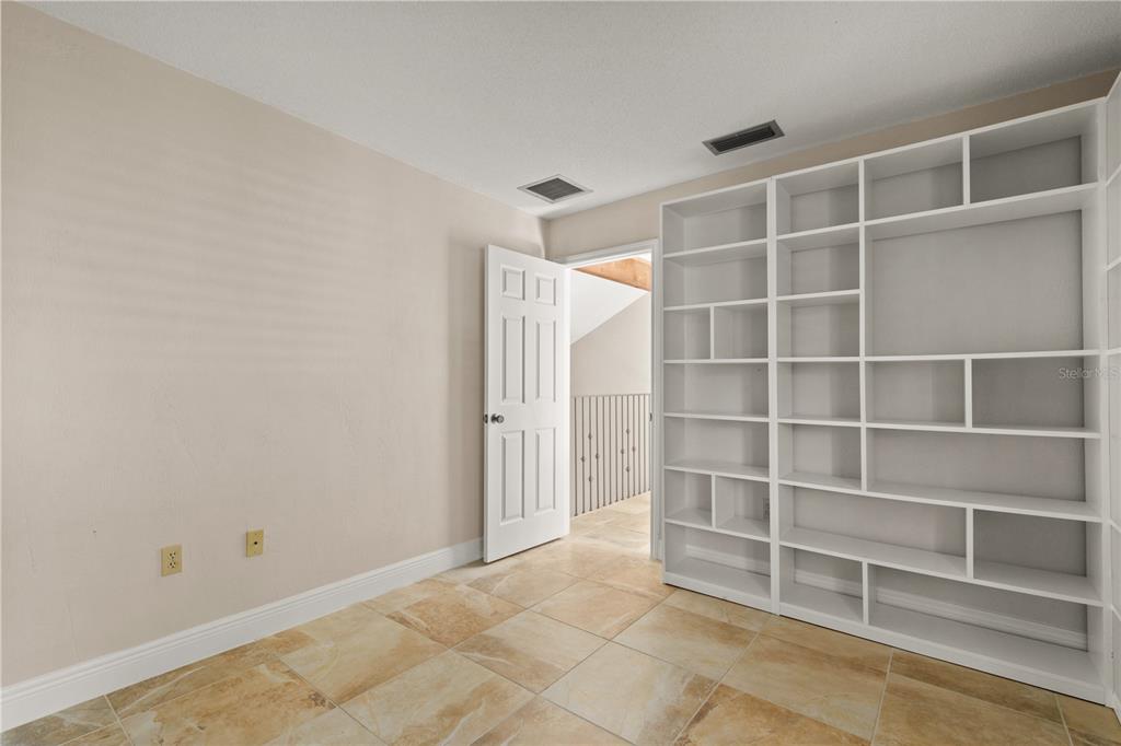 100 Bittern Court Daytona Beach, FL 32119 - Photo 27 of 52 a view of an empty room with empty shelves