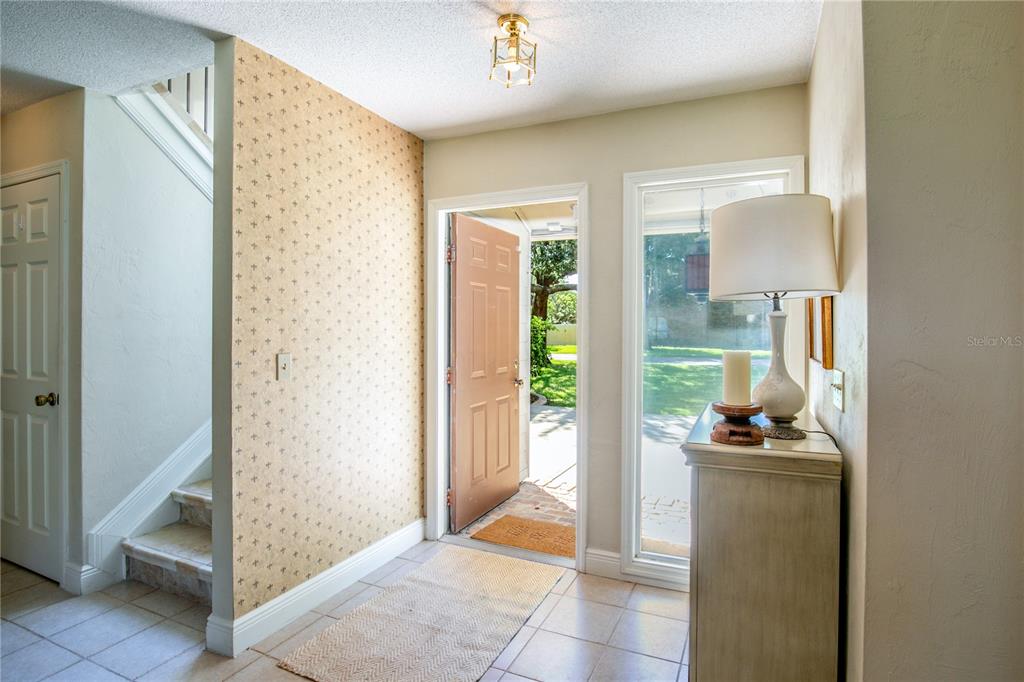 100 Bittern Court Daytona Beach, FL 32119 - Photo 3 of 52 a bedroom with a bed and a mirror