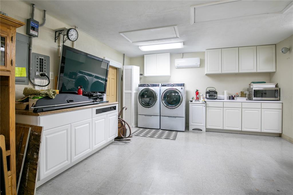 100 Bittern Court Daytona Beach, FL 32119 - Photo 32 of 52 a utility room with sink dryer and washer