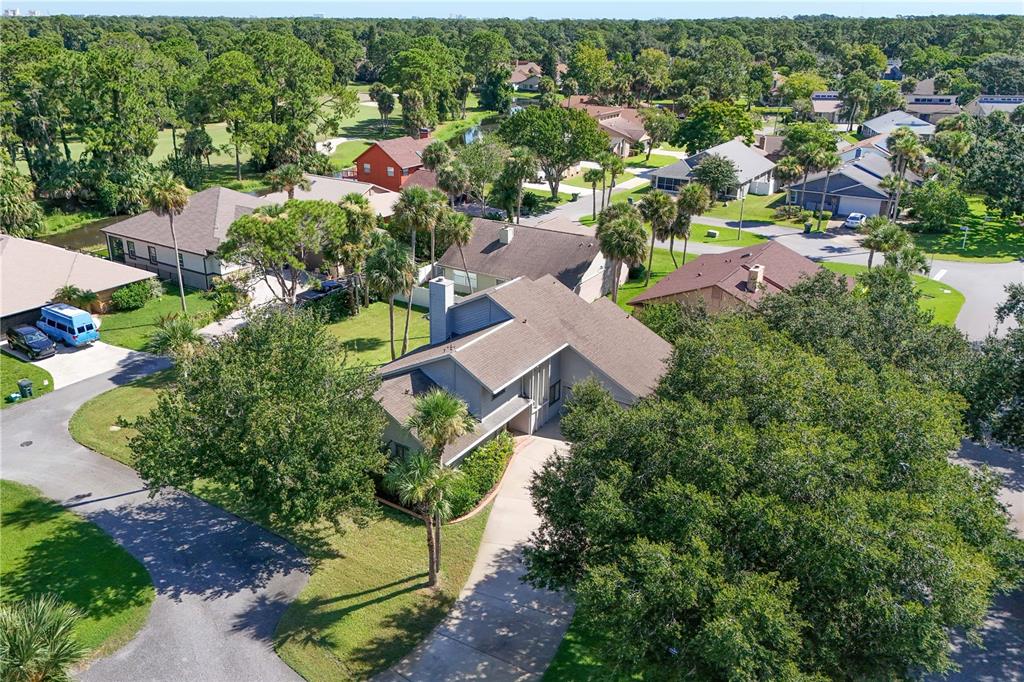 100 Bittern Court Daytona Beach, FL 32119 - Photo 38 of 52 an aerial view of residential house with outdoor space and trees all around