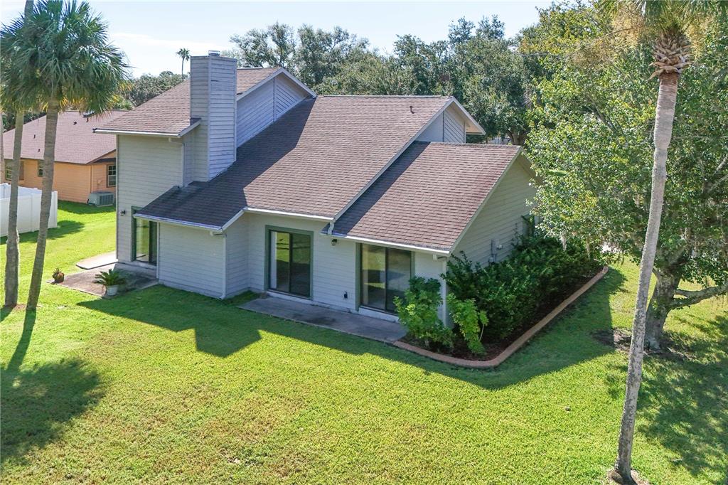 100 Bittern Court Daytona Beach, FL 32119 - Photo 39 of 52 a aerial view of a house with swimming pool next to a big yard