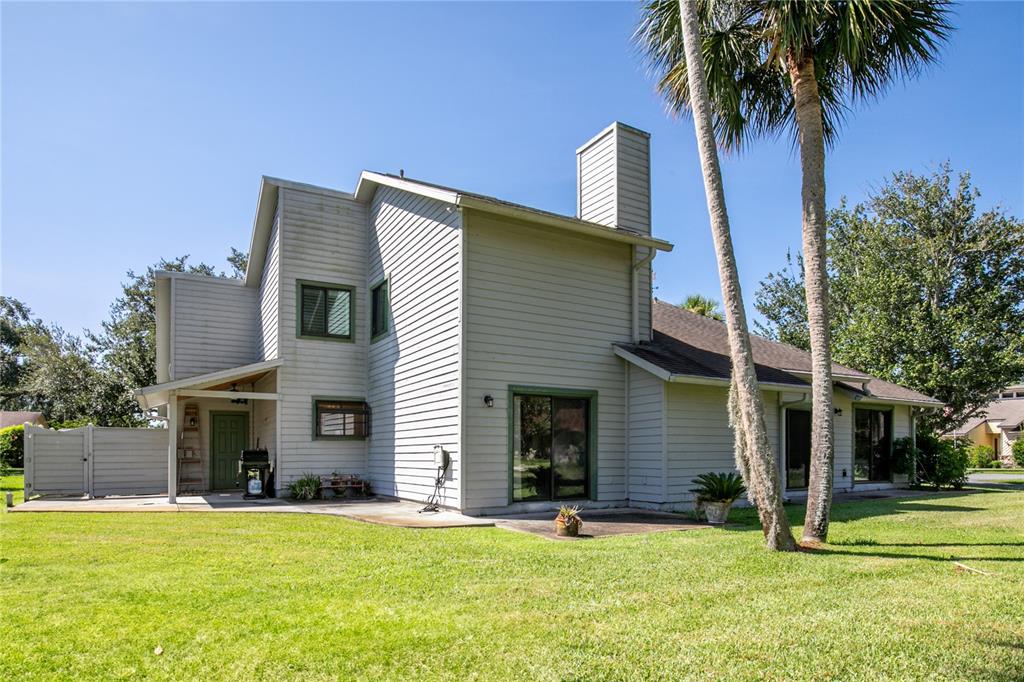 100 Bittern Court Daytona Beach, FL 32119 - Photo 43 of 52 a view of a house with a yard and palm trees