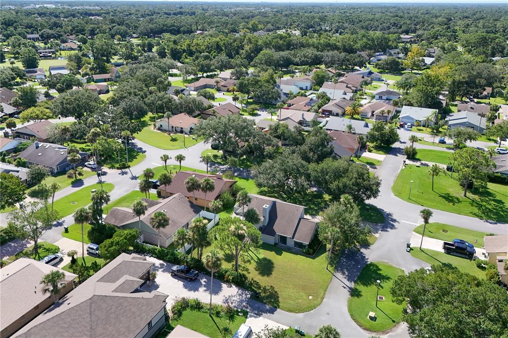 100 Bittern Court Daytona Beach, FL 32119 - Photo 47 of 52 an aerial view of residential houses with outdoor space and trees